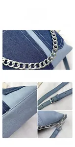Detail of denim patchwork crossbody bag with metal chain and contrast stitching