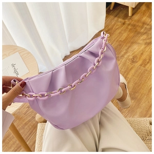 Detail of lavender pleated cloud bag with resin chain link and soft faux leather texture