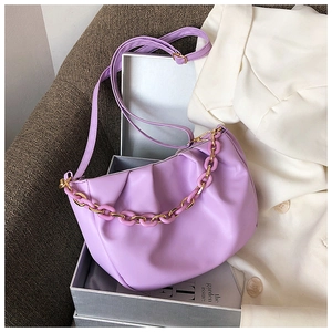 Close-up of a purple ruched cloud bag featuring a stylish chunky matte chain strap