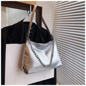 Close-up of the metallic silver leather hobo bag with a chunky silver chain detail
