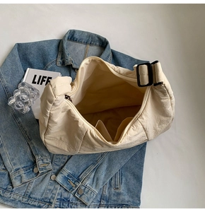 Top view of beige quilted nylon puffer tote showing spacious main pocket and inner pocket
