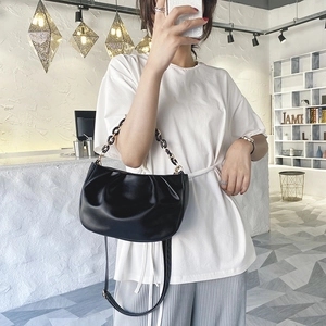 Chic black pleated croissant bag with chain strap and crossbody option for women