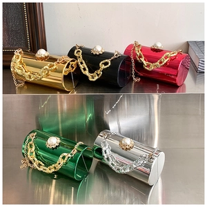 Detail of luxury mirror cylinder clutch bags with pearl rhinestone clasps in various colors