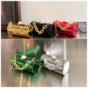 Five metallic cylinder clutch bags in gold, silver and red with pearl rhinestone clasps