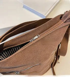 Detail of smooth metal zipper and striped lining on vintage corduroy backpack