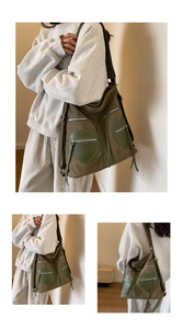Detail of army green corduroy backpack showing heart-shaped pockets and tassels