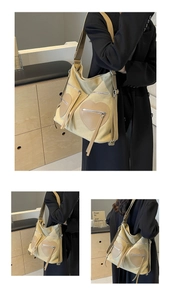 Detail view of khaki canvas tote with heart pockets, brown leather trim and long tassels