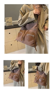 Detail of vintage corduroy backpack showing heart leather pockets and metallic zipper textures