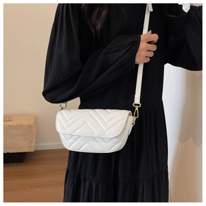 White quilted crossbody bag with gold hardware and elegant V-shaped stitching detail