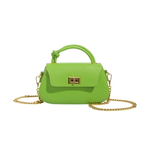 Minimalist bright green leather handbag with gold twist lock and knot handle