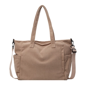 Minimalist beige corduroy tote bag with adjustable shoulder strap and side pockets