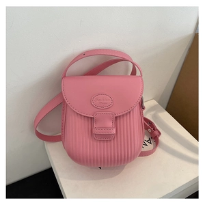 Detail of pink mini crossbody bag featuring vertical striped texture and Fashion Bag logo