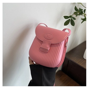 Close-up of pink crossbody bag featuring vertical stripe texture and Fashion Bags logo