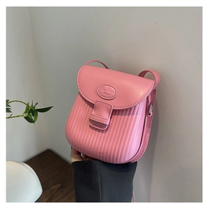 Detailed view of pink mini crossbody bag featuring striped texture and fashion logo