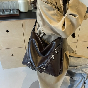 Large vintage brown tote bag with stylish zippers and metallic buckles for daily commute