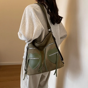 Olive green corduroy backpack for women featuring large capacity and heart zip pockets