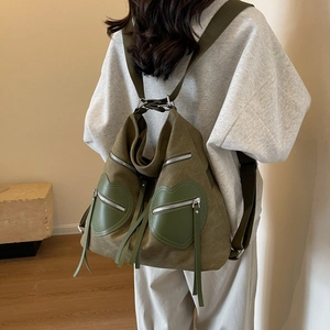 Army green vintage corduroy backpack with heart-shaped pockets and tassel zippers