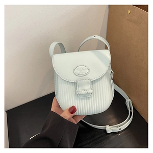 Detail of mint blue crossbody bag with vertical ribbed texture and Fashion Bags logo