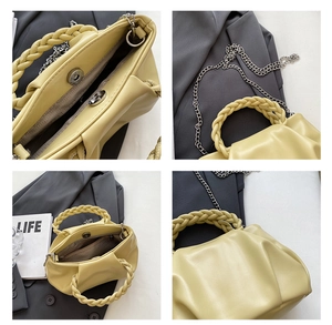 Macro view of pleated cream crossbody bag showing magnetic closure and interior zipper pocket
