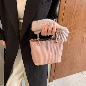 Pink pleated bucket bag with vertical texture and matching scarf accessory