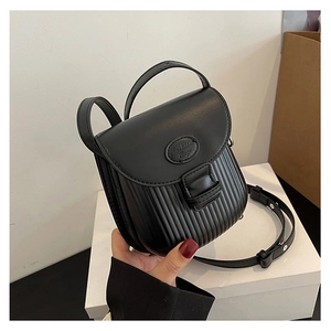 Detail of black pleated leather crossbody bag with Fashion Bags logo on a hand-held display