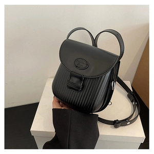 Detailed view of black pleated crossbody bag with Fashion Bags logo and adjustable strap