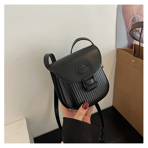 Detail of fashion black mini crossbody bag with vertical pleats and Fashion Bag logo