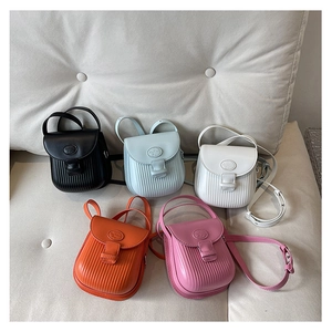 Detail view of stylish crossbody bags in five colors with vertical striped embossing texture