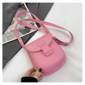 Detail of pink PU leather mini bag with vertical stripes and Fashion Bag embossing
