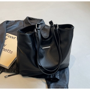 Detail of black lychee grain tote bag showing high-quality texture and silver hardware