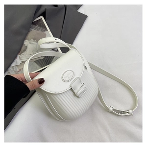 Detail of white PU leather crossbody bag featuring pleated texture and gold fashion logo