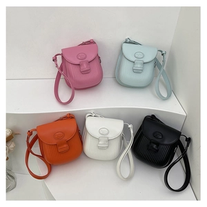 Collection of mini crossbody bags in five colors with stylish vertical embossed patterns