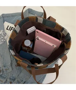 Top view of large striped tote bag interior showing spacious storage and inner pockets
