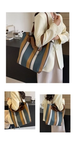 Detailed view of the large striped canvas tote bag with contrast woven pattern and sturdy handles