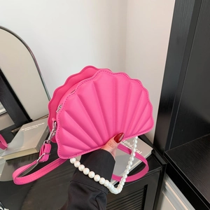 Elegant rose pink shell bag with pearl handle and adjustable strap for summer fashion