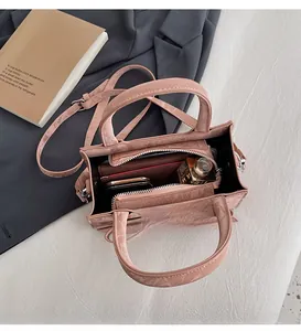 Top view of pink crocodile pattern tote with multi-layer interior and large capacity