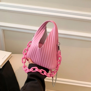 Close-up of pink pleated PU shoulder bag with thick acrylic and thin metal chains