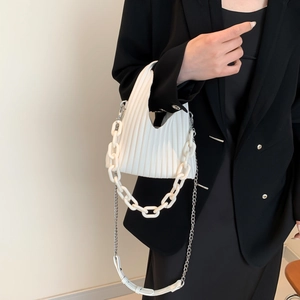 Chic pleated white PU shoulder bag with dual resin and metal chain straps on model