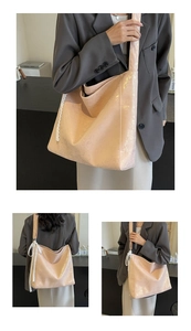 Detail of light pink bucket bag with wrinkled texture and white lace strap decoration