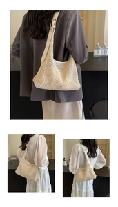 Close-up of beige mesh woven hobo bag with adjustable leather strap and golden buckle