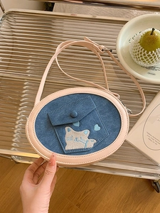 Oval denim and pink leather crossbody bag with cute cat embroidery and chain strap