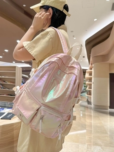 Pink holographic laser backpack for women with iridescent finish and multiple pockets