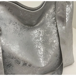 Close-up of metallic silver crackle texture and premium material on a large bucket bag