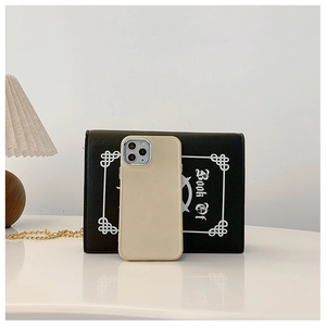 Detail of beige iPhone 14 Pro case with matte texture and silver metallic camera frame