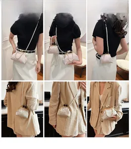 Detailed views of vintage embroidered handbag with pearl handles and floral patterns