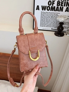 Dusty rose square mini crossbody bag with gold D-ring buckle and round top handle
