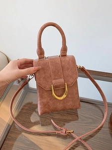 Chic pink mini square handbag with textured leather surface and gold U-shaped metal clasp