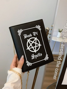 Gothic black leather book-shaped crossbody bag with white Book Of Spells print and gold chain