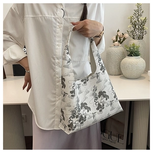 Detail of Chinese ink painting style pattern on a premium shoulder bucket bag