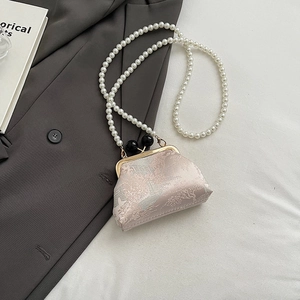 Detail of Chinese style retro embroidery handbag with pearl chain and dual ball clasps